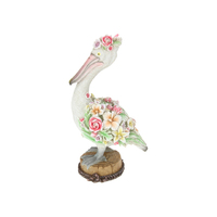 40CM PELICAN WITH FLORAL DESIGN ON LOG